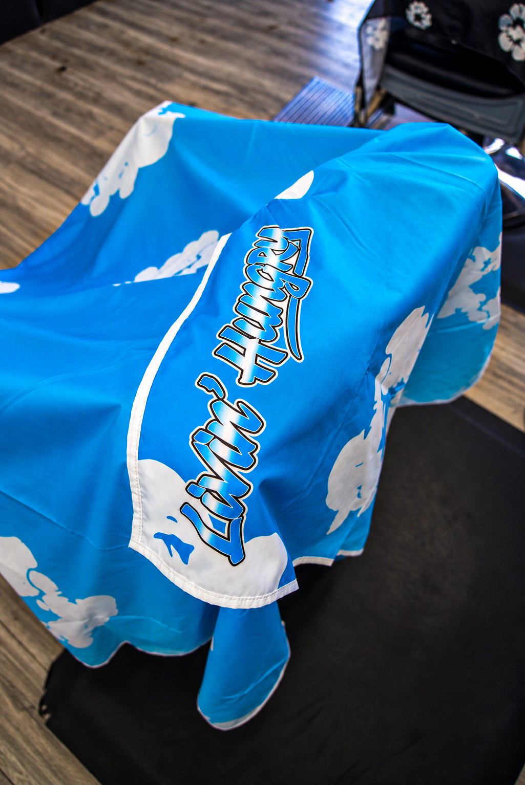 LIVIN’ HUNGRY “CYAN FLORAL” BARBER CAPE