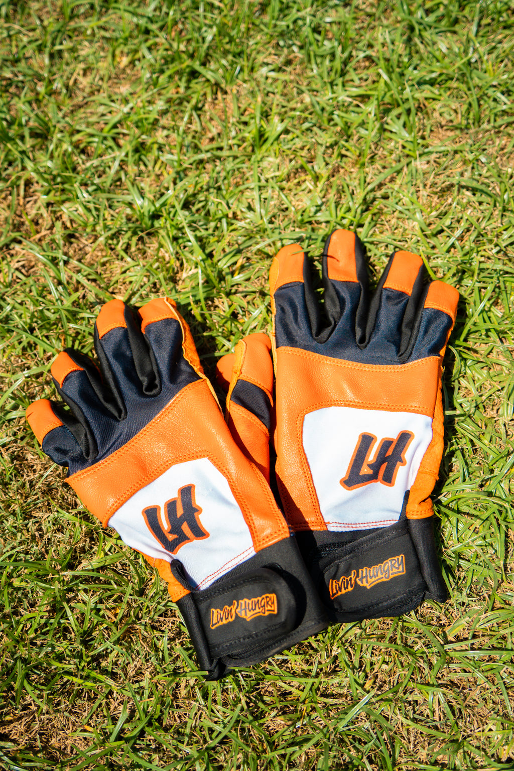 LIVIN’ HUNGRY ORANGE/WHITE BATTING GLOVES