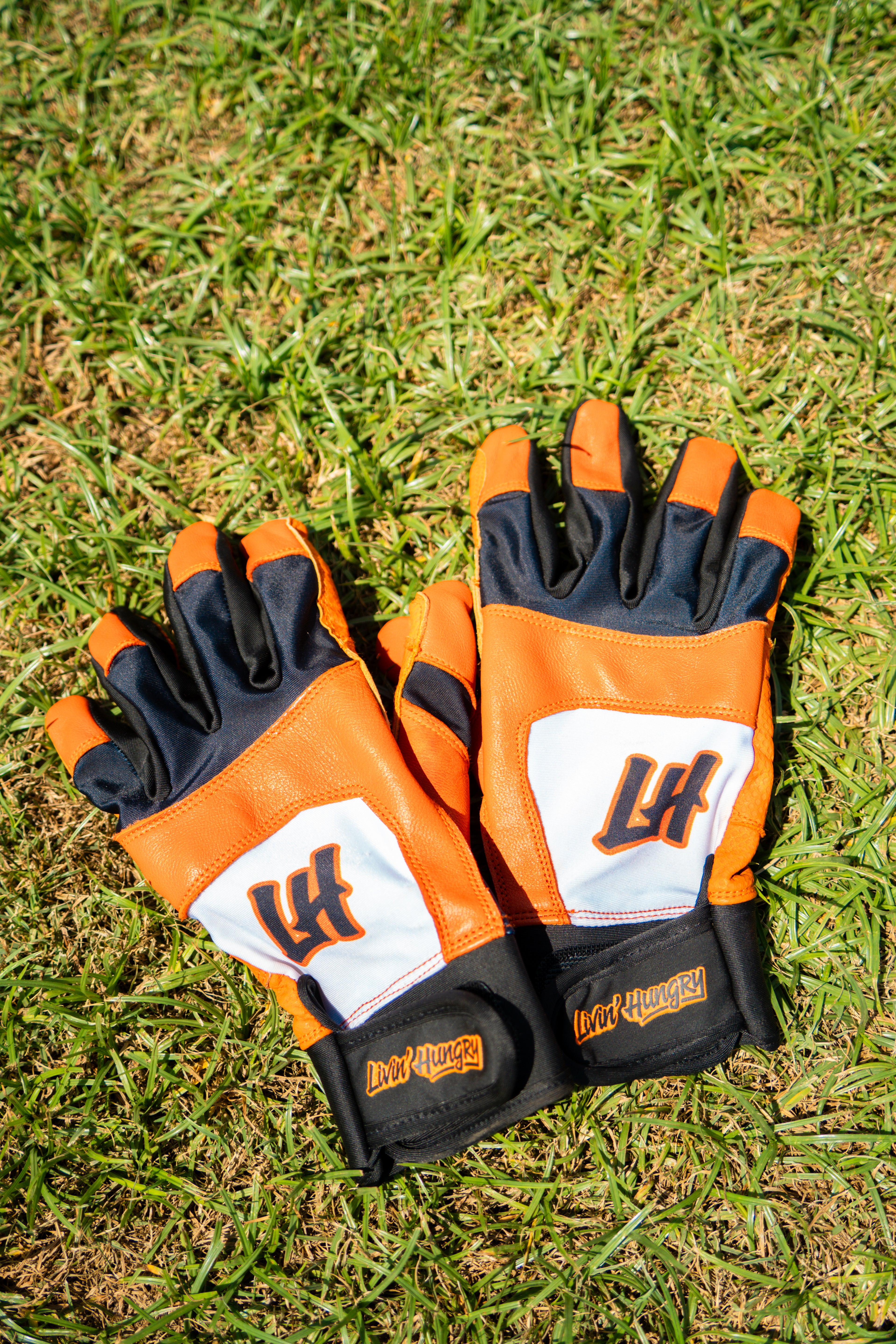 LIVIN’ HUNGRY ORANGE/WHITE BATTING GLOVES