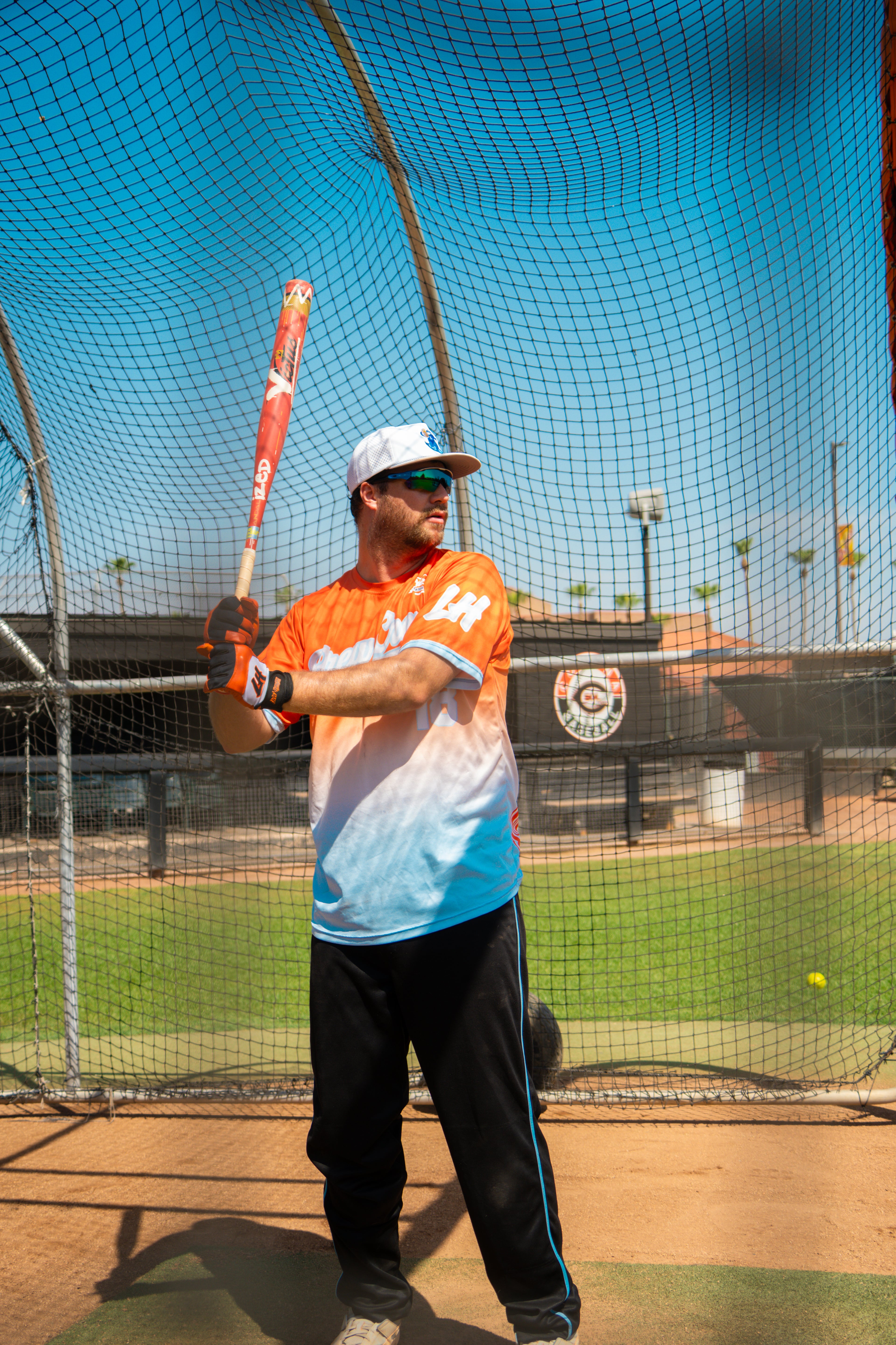 LIVIN’ HUNGRY ORANGE/WHITE BATTING GLOVES