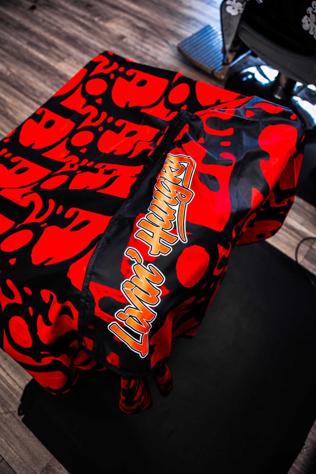 LIVIN’ HUNGRY “ORANGE MONOGRAM” BARBER CAPE